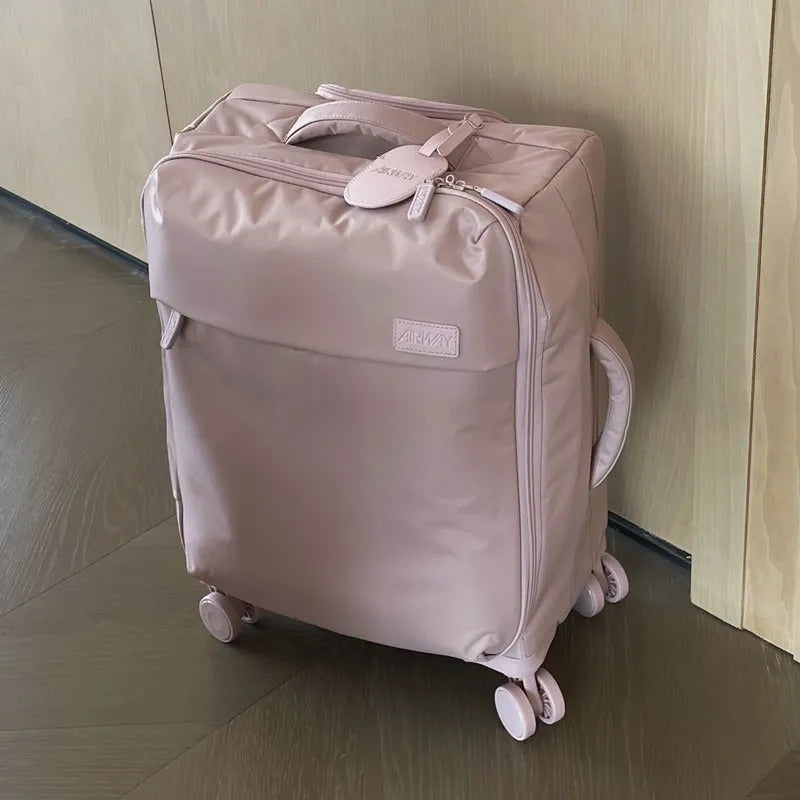 Waterproof Oxford cloth suitcase with universal wheels in six colour options including tea brown and haze blue