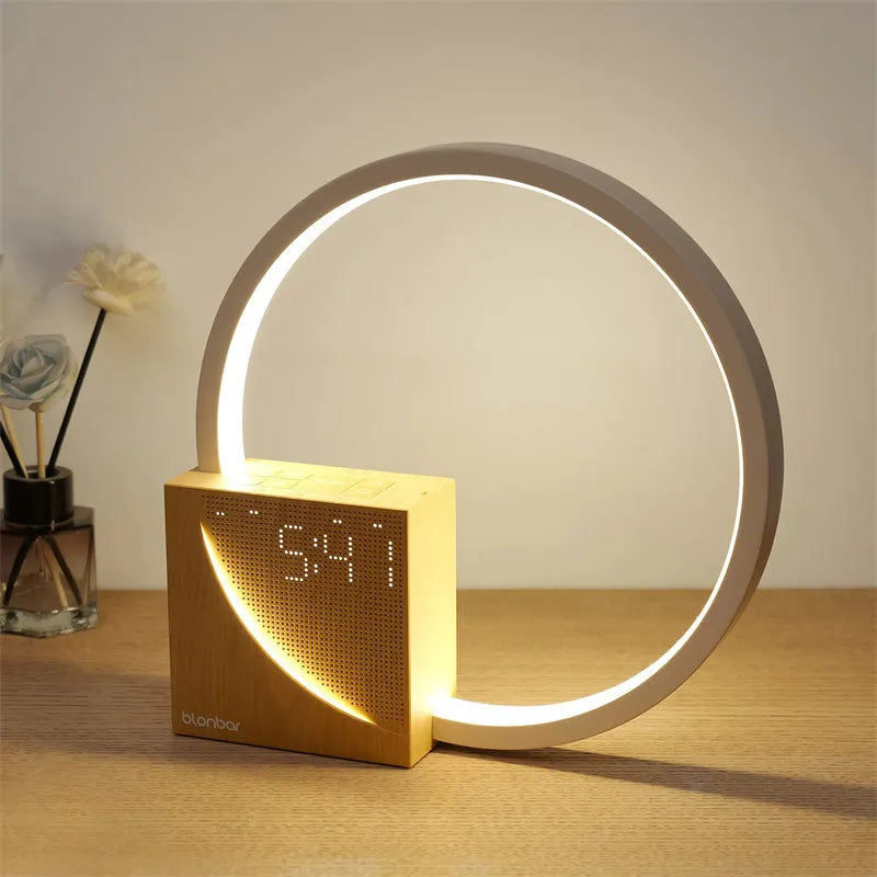 Navy blue touch control bedside lamp with digital alarm clock display on wooden table