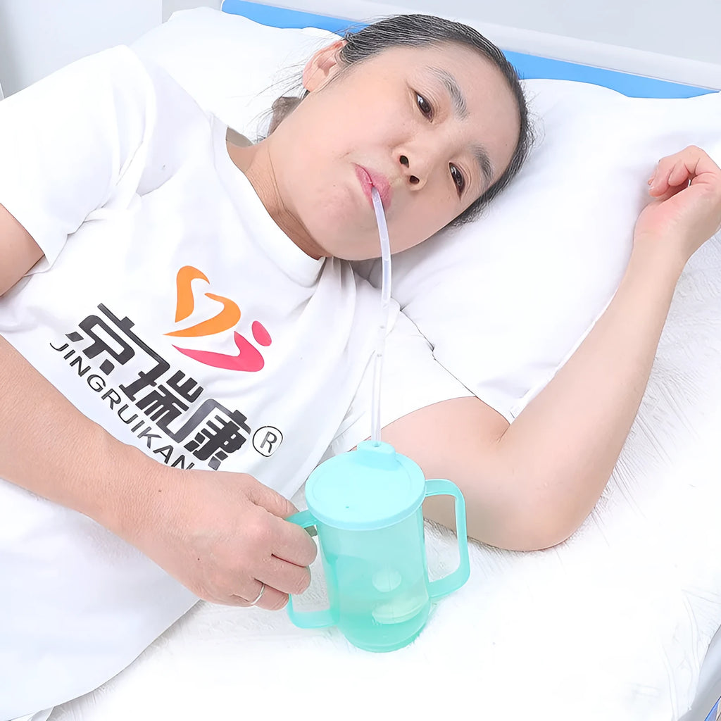Oblique mouth choke proof drinking cup with optional wrist splint for elderly and pregnant women bed use