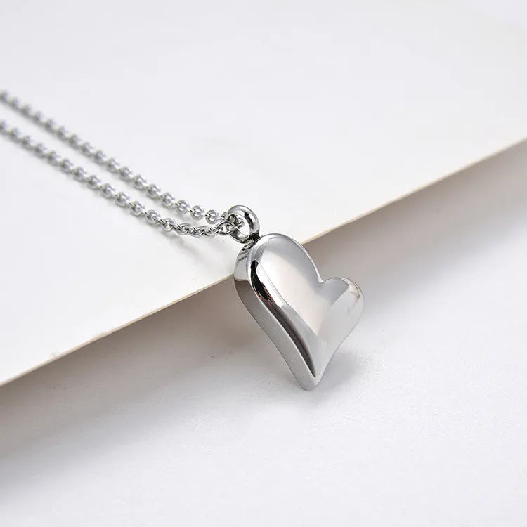 Silver curved peach heart stainless steel pendant necklace with adjustable chain