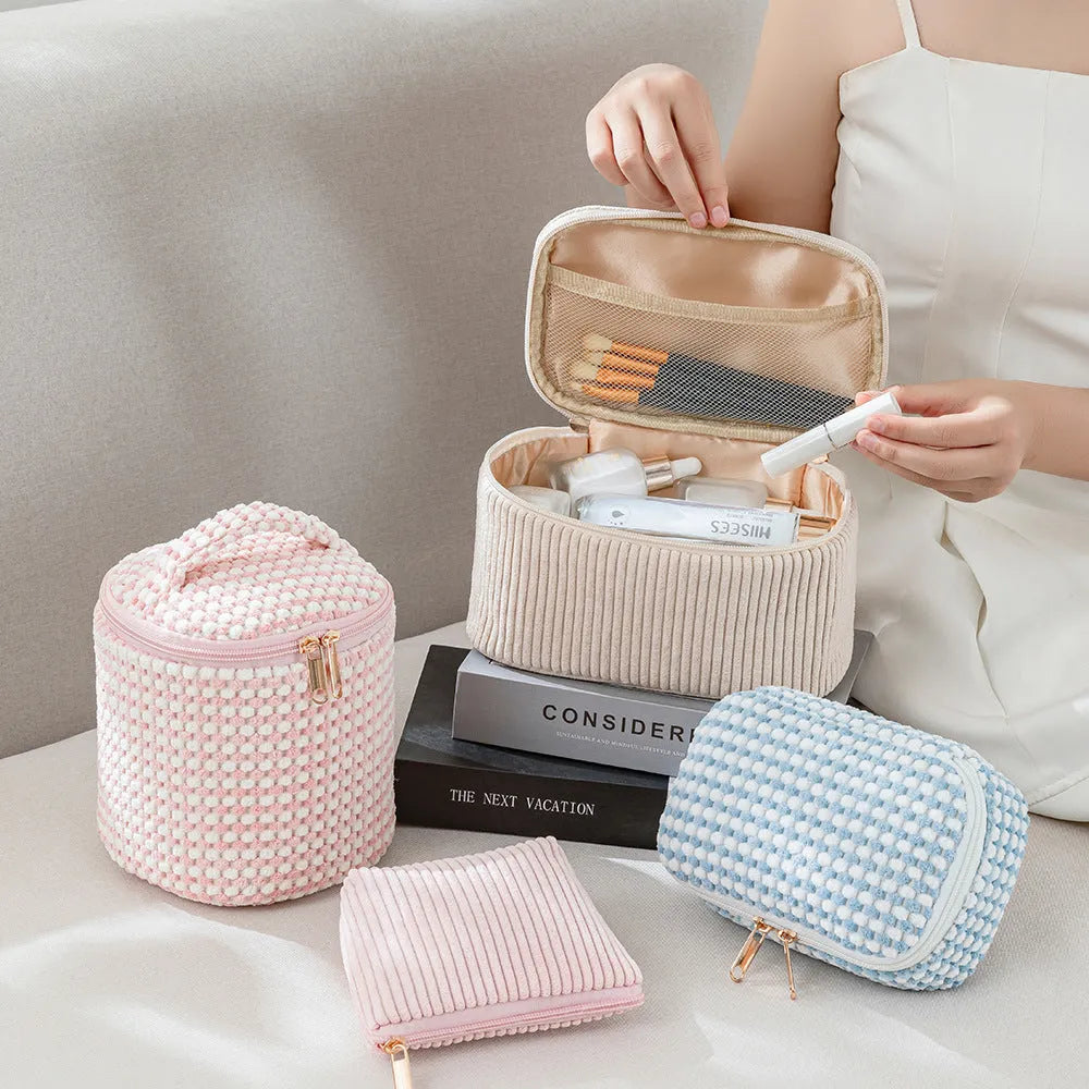 Four cube-shaped flannelette makeup bags in a set, showing pink dots and solid colour options.