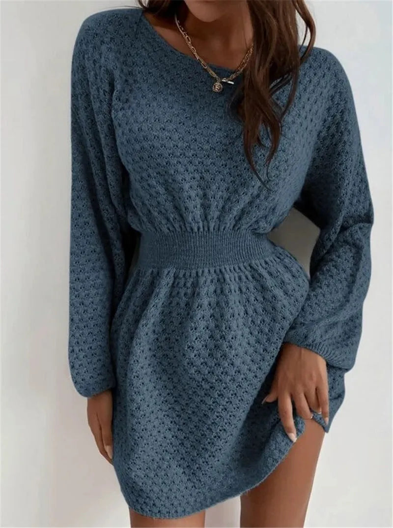Blue women's knitted dress with crochet flower detail and a fitted waist.