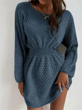 Blue women's knitted dress with crochet flower detail and a fitted waist.