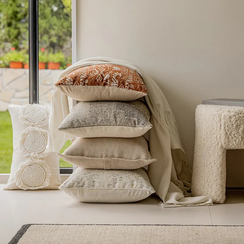 Coreless pillow cushion with pp cotton filler in solid colours on a sofa.