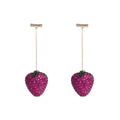 Red zinc alloy strawberry earrings with geometric shape and spot drill texture.