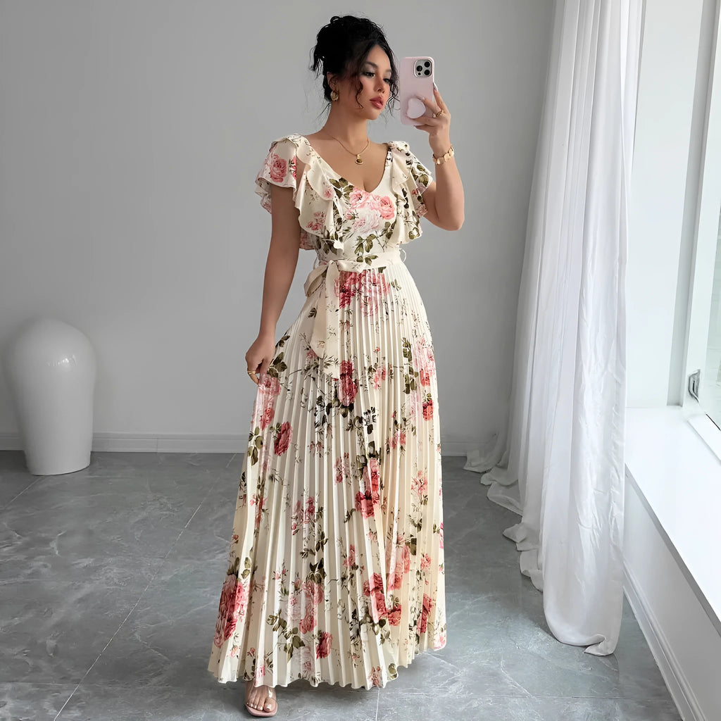 Apricot floral print women's dress with v-neck, ruffled short sleeves, and a high-waisted pleated swing skirt.