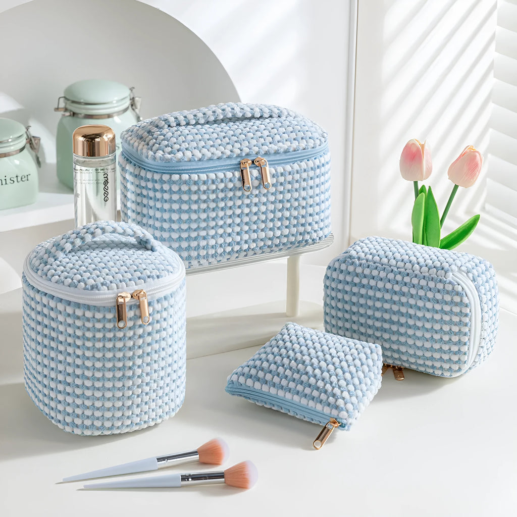 Four cube-shaped flannelette makeup bags in a set, showing pink dots and solid colour options.