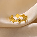 Geometric titanium steel women's ring with gold diamond finish showing free size fit