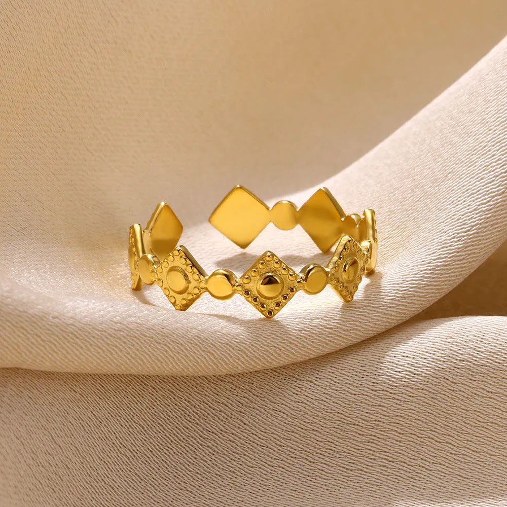 Geometric titanium steel women's ring with gold diamond finish showing free size fit