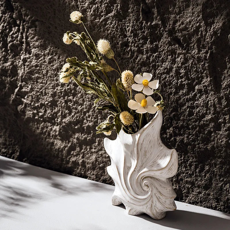 French-style retro ceramic vase with coloured glaze in a European decorative design.