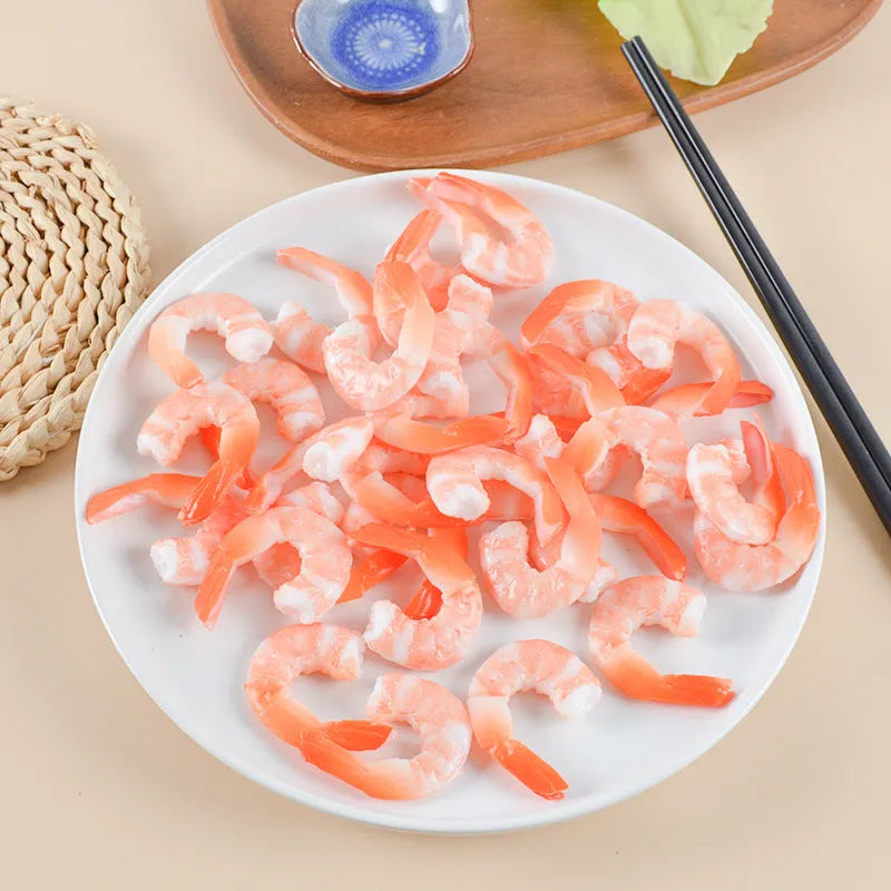 PVC shrimp-shaped keychain with metal door buckle, showing detailed crustacean design.