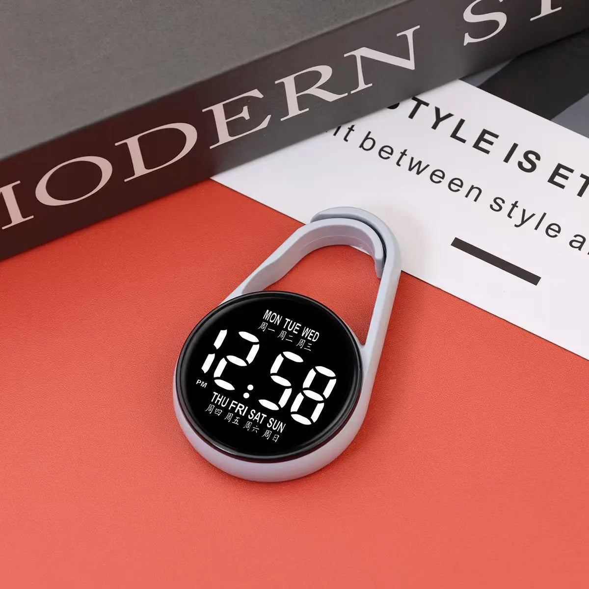 Simple luminous LED digital watch with a plastic strap, shown in one of ten available colours.