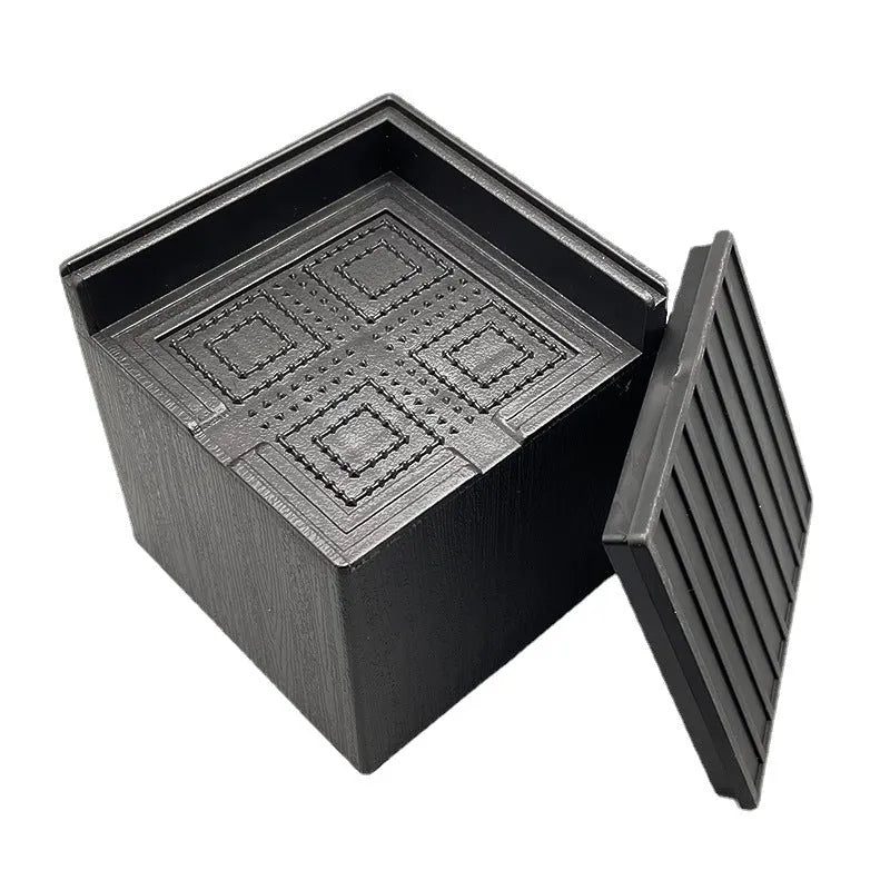Four black plastic furniture riser mats for bed and sofa feet height adjustment