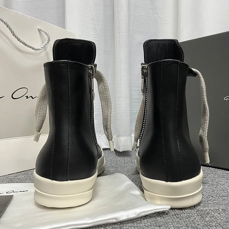 Genuine leather high-top sneakers with side zipper in black, shown on a white background.