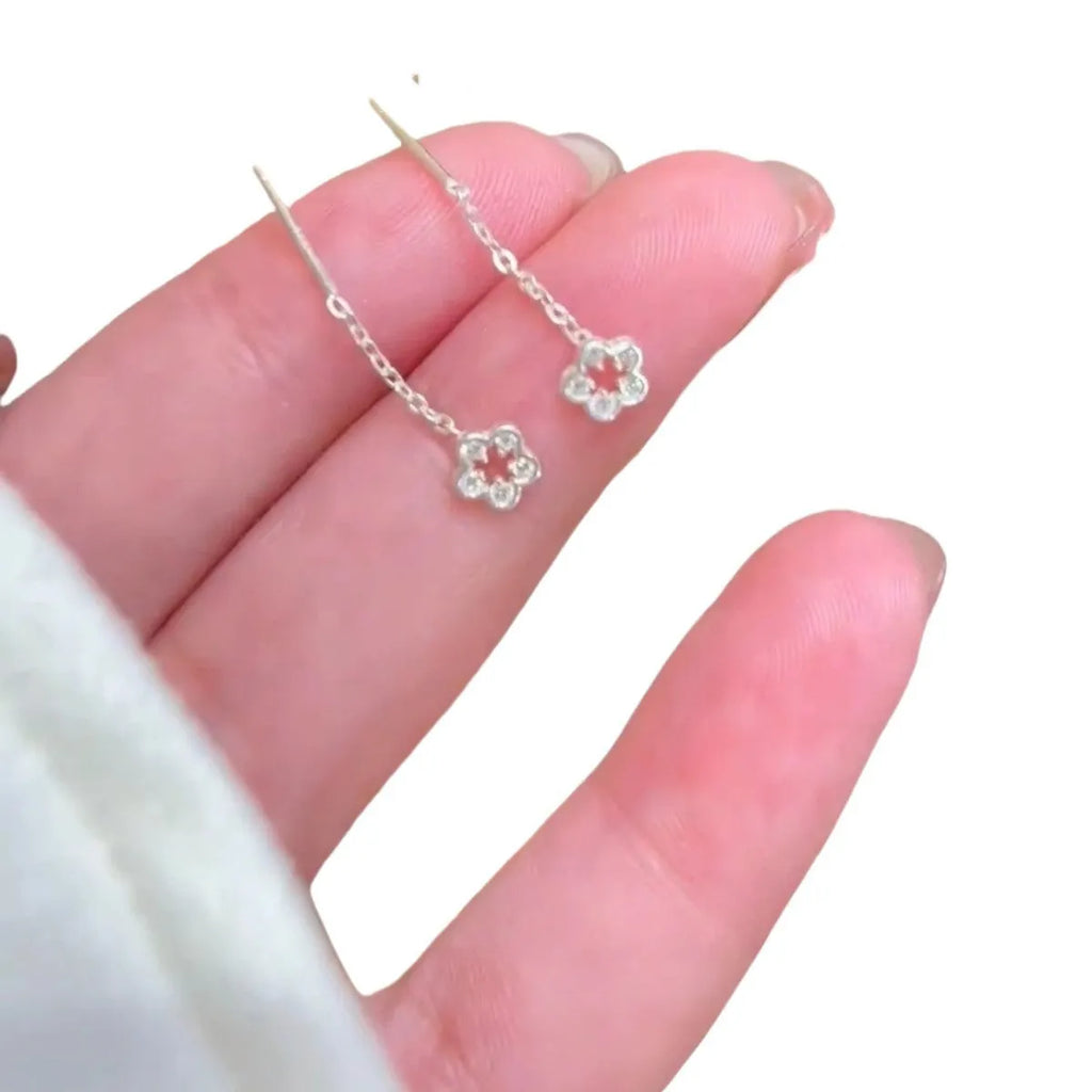 Silver hollow flower hanging earrings with petal design on alloy studs