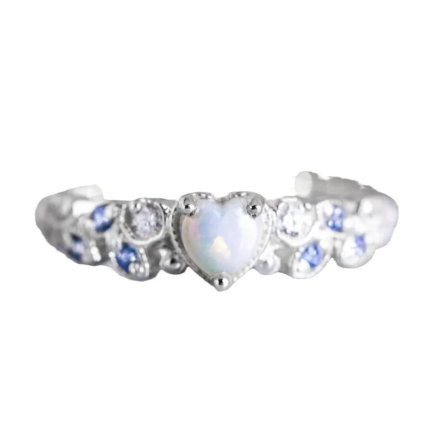 Women's white alloy heart ring with a detailed floral and opal ocean pattern.