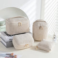 Four cube-shaped flannelette makeup bags in a set, showing pink dots and solid colour options.