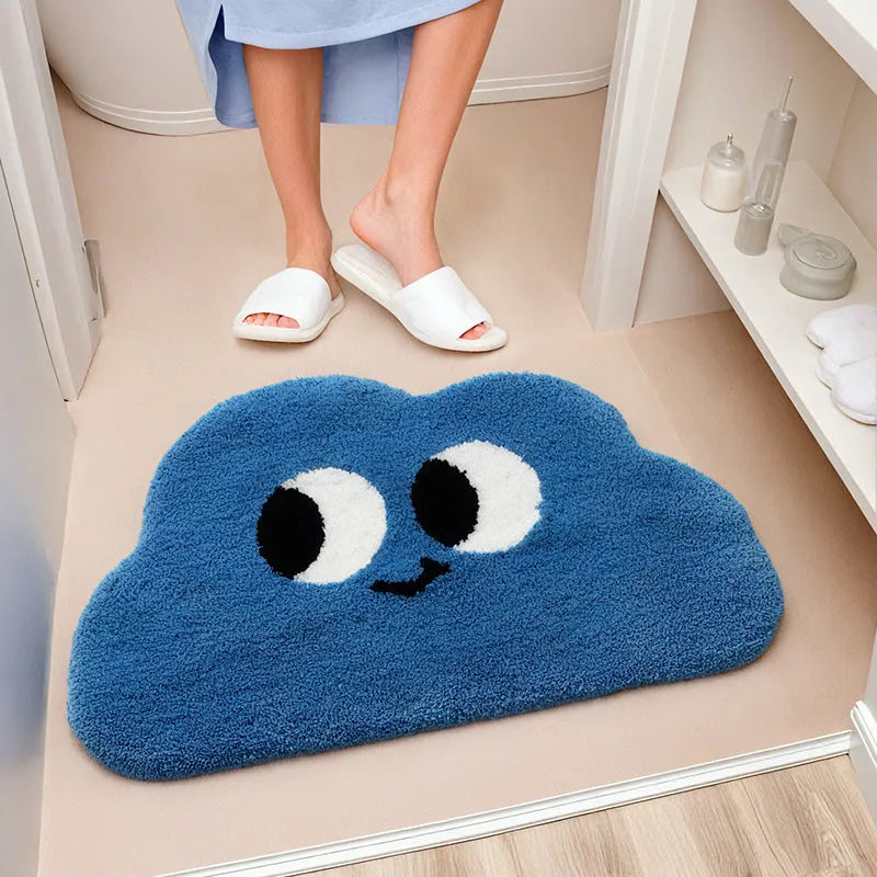 Colourful Big Eye Clouds cartoon character printed on a soft, plush light green bathroom mat.