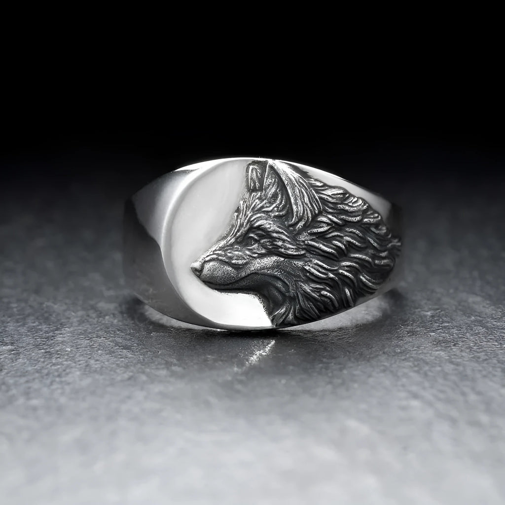 Silver alloy men's ring with a geometric wolf design on a black background.