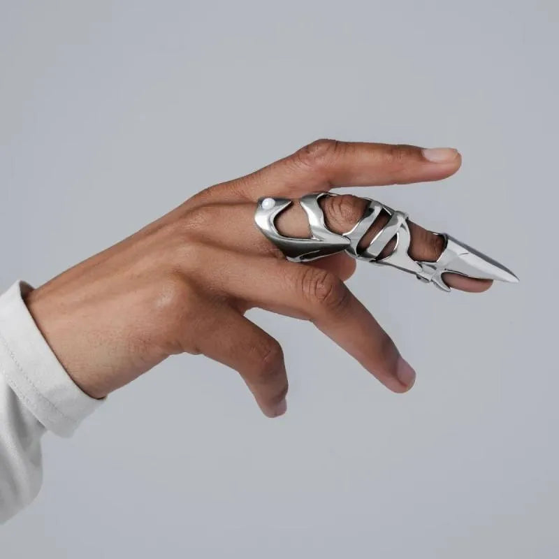 Silver alloy punk armour finger stall ring on a single finger.
