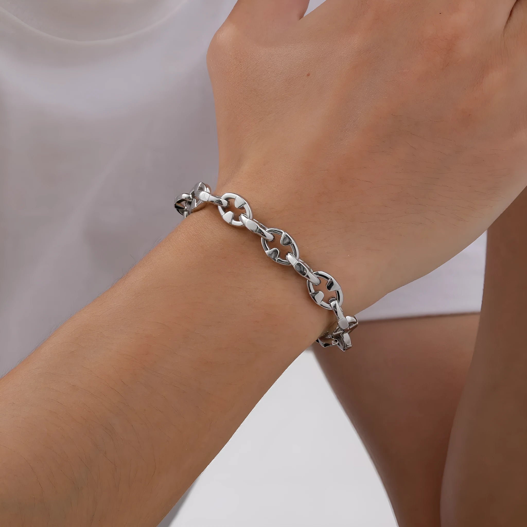 A thick stainless steel chain bracelet with geometric links, shown in a steel colour.