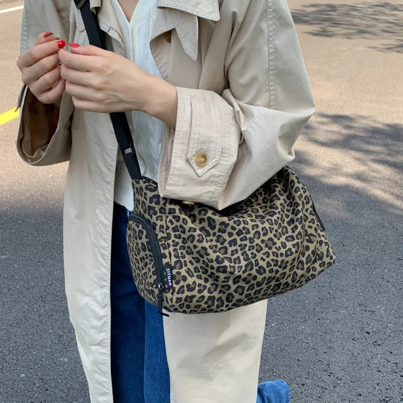 Large capacity leopard print sports style shoulder messenger bag with breathable cloth and stitching details