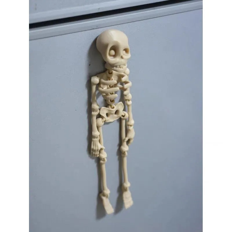 A detailed 3D printed white skull refrigerator magnet, 18cm tall, against a dark background.