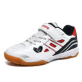 Lightweight white and blue badminton shoes with ribbed sole on an indoor court.