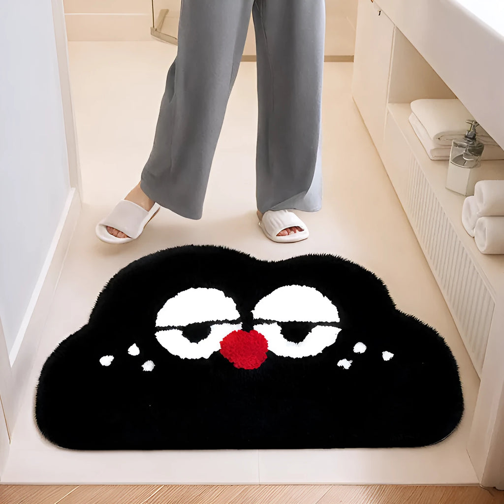 Colourful Big Eye Clouds cartoon character printed on a soft, plush light green bathroom mat.