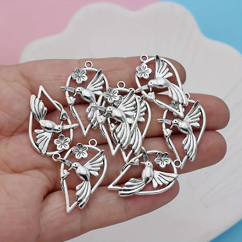 Alloy magpie pendant charm with electroplated finish in colour P234 for DIY jewellery crafting.