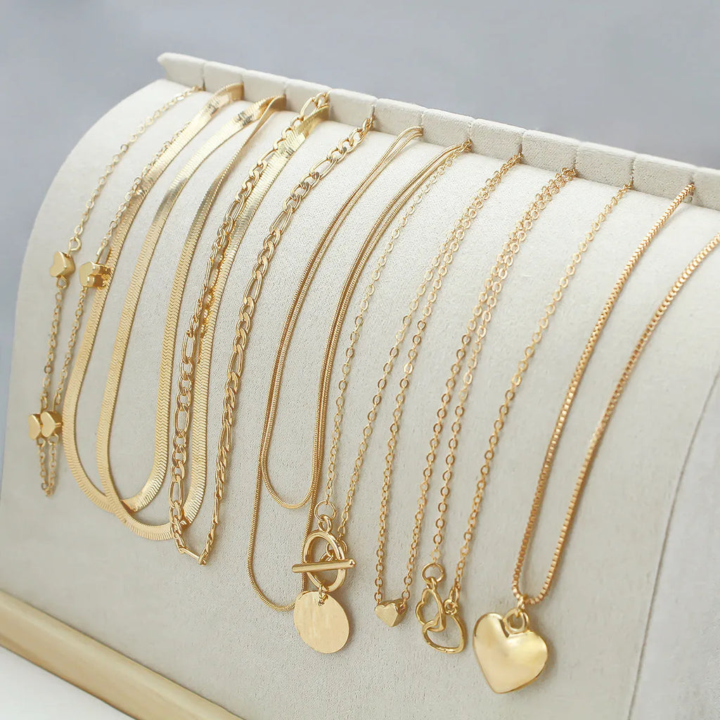 10-piece gold electroplated women's necklace set with snake bone chains and alloy pendants