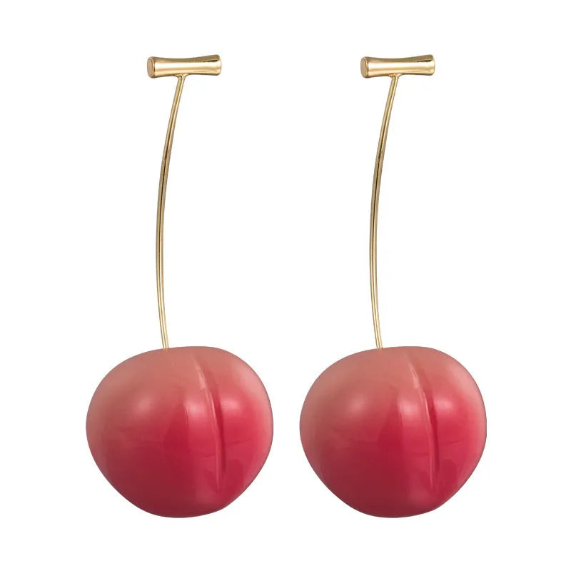 A pair of acrylic peach fruit earrings on copper posts, shown in small and large size options.