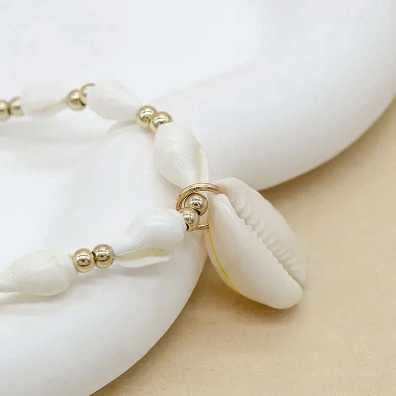White electroplated shell necklace with mother pearl conch pendant on regular chain