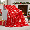 Soft red plush Christmas blanket draped over a sofa corner.