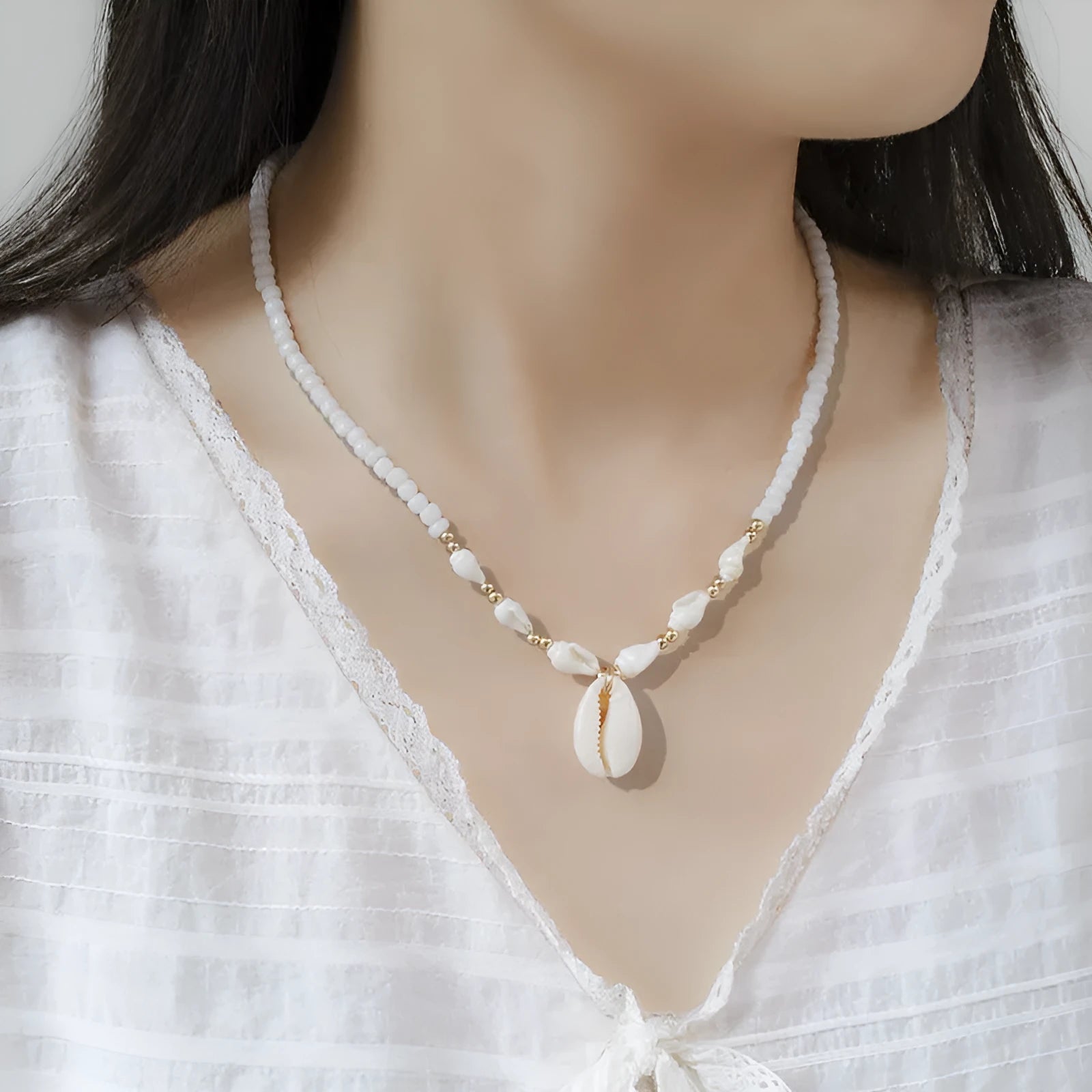 White electroplated shell necklace with mother pearl conch pendant on regular chain
