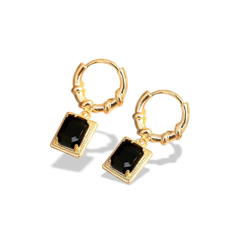A pair of black geometric quadrilateral zircon earrings with a French Court retro design on a white background.