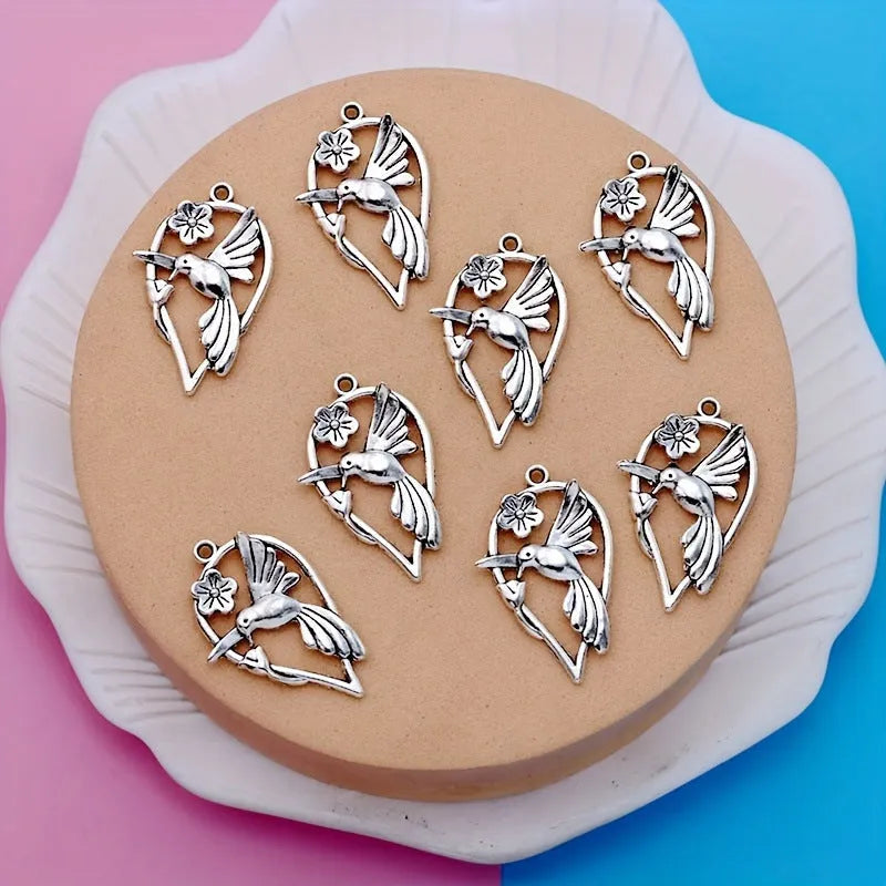 Alloy magpie pendant charm with electroplated finish in colour P234 for DIY jewellery crafting.