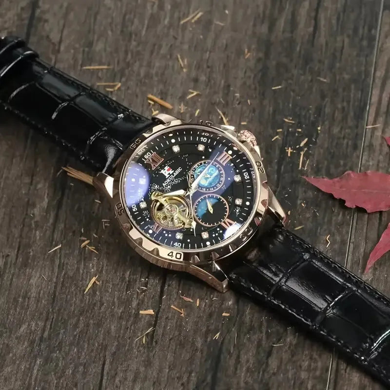 Men's black and rose gold automatic skeleton watch on a leather strap