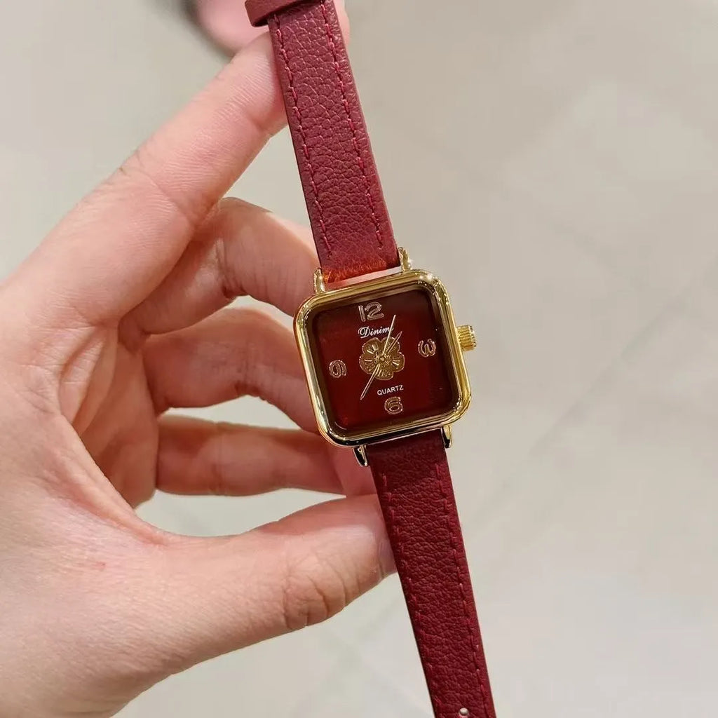 Chinese style alloy women's watch showing decorative patterns like camellia or octagonal diamond on a 8mm thick case.