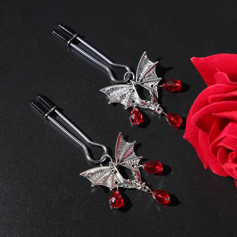 Silver alloy diamond bat nipple clamp with adjustable pressure and ruby bat decorative design