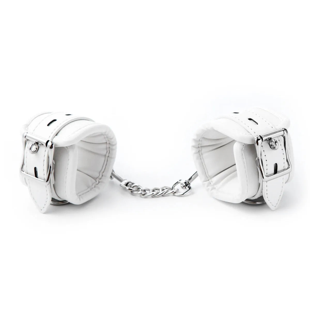 White PU sponge bondage restraint set showing handcuffs, foot cuffs, and a neck scarf on a dark surface.