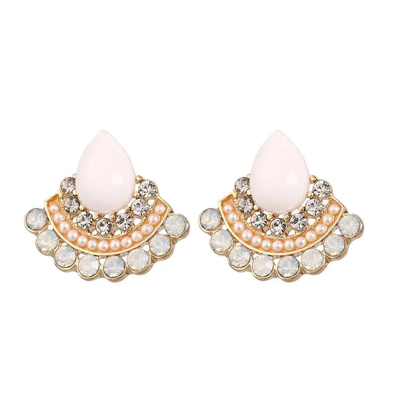 Women's silver geometric fan-shaped stud earrings with a central rhinestone on a white background.