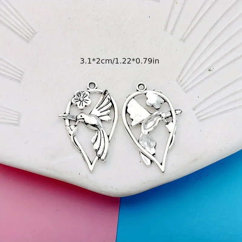 Alloy magpie pendant charm with electroplated finish in colour P234 for DIY jewellery crafting.
