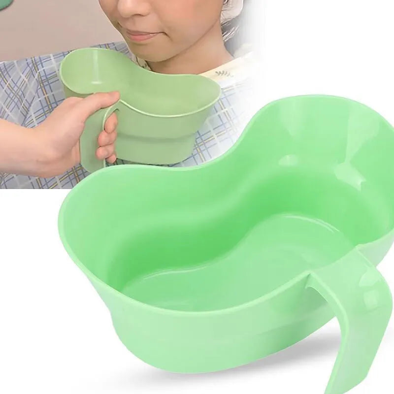 Green plastic bedridden patient gargle cup for nursing care and oral hygiene.