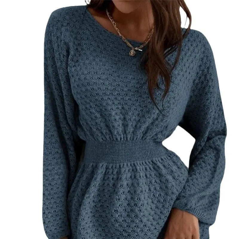 Blue women's knitted dress with crochet flower detail and a fitted waist.