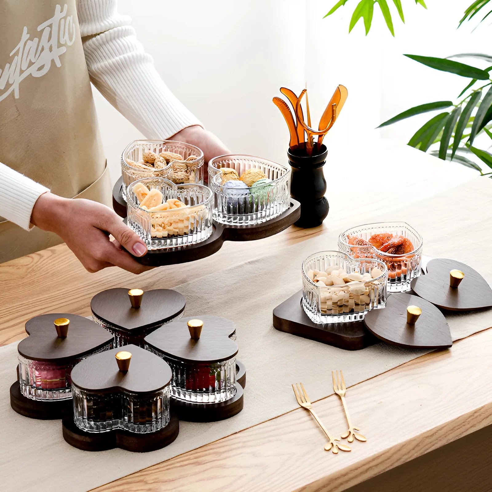 Glass snack plate with heart-shaped lids on a multi-grid tray in a retro style.