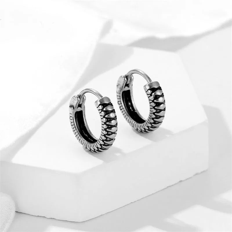 Silver geometric alloy earrings with retro twist design and striped sports-style elements