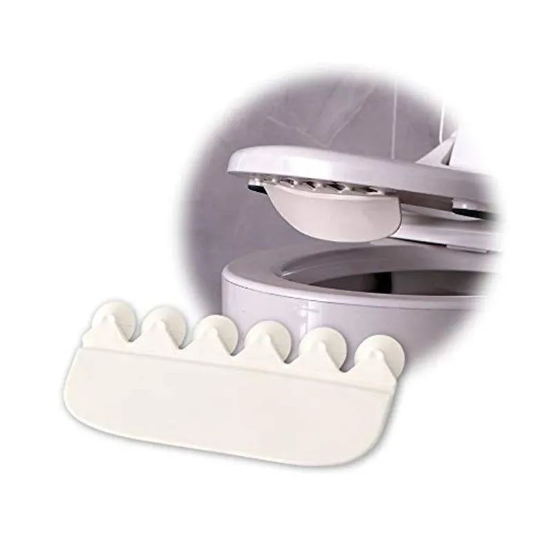 White plastic urine blocking board for toilet training placement on standard toilet bowl
