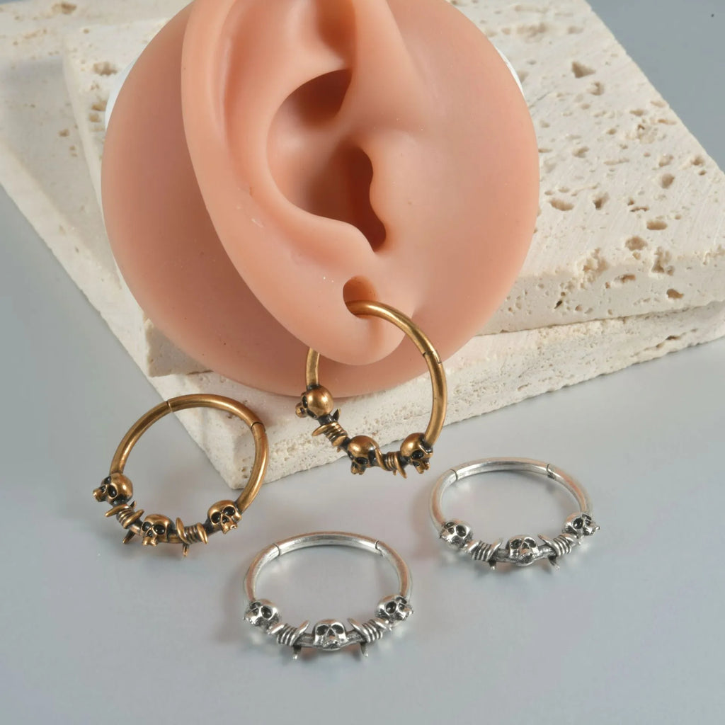 Copper ghost head punk earrings in ancient silver or gold finish with single or triple design