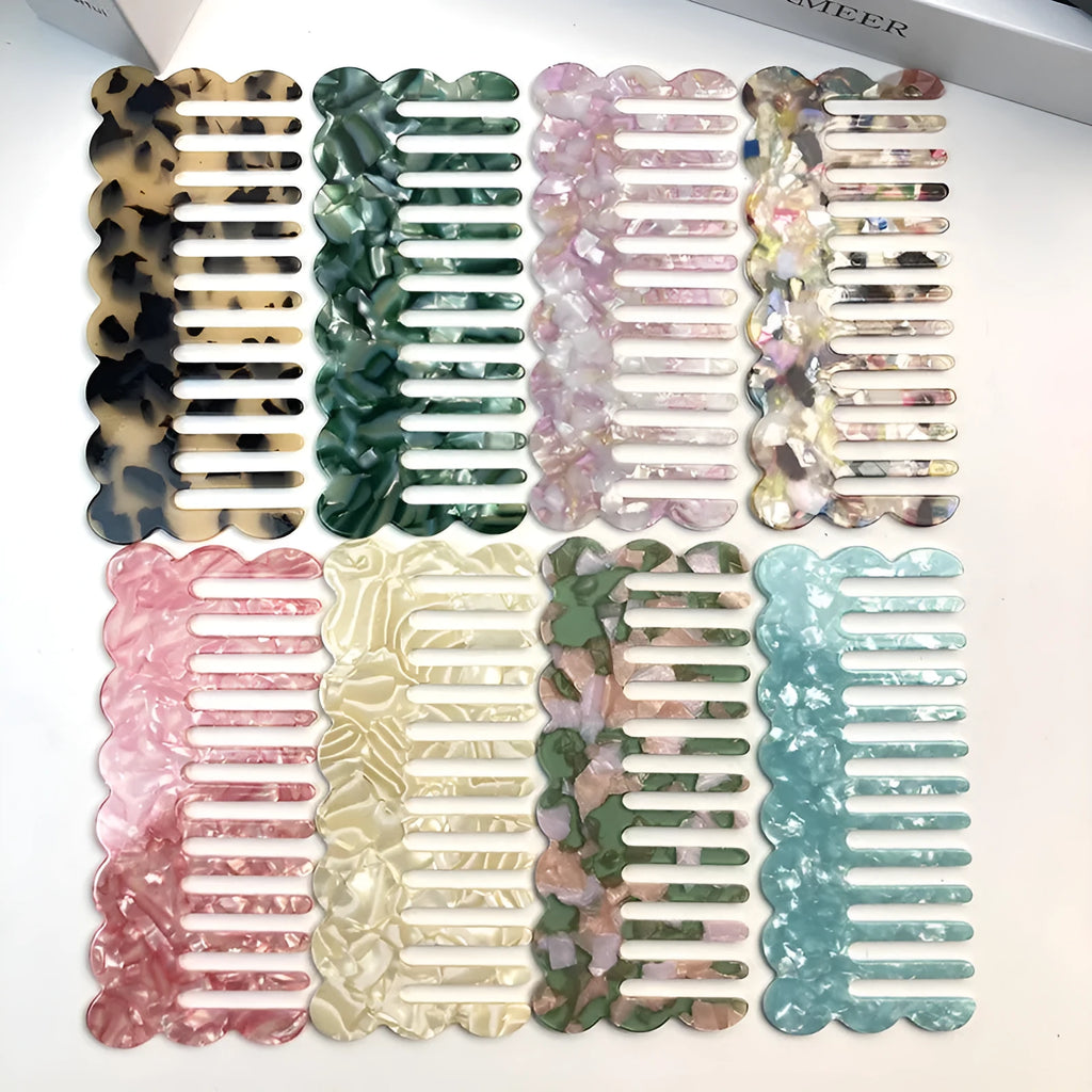 Acetate board hair comb with geometric wave design in a selection of colours.